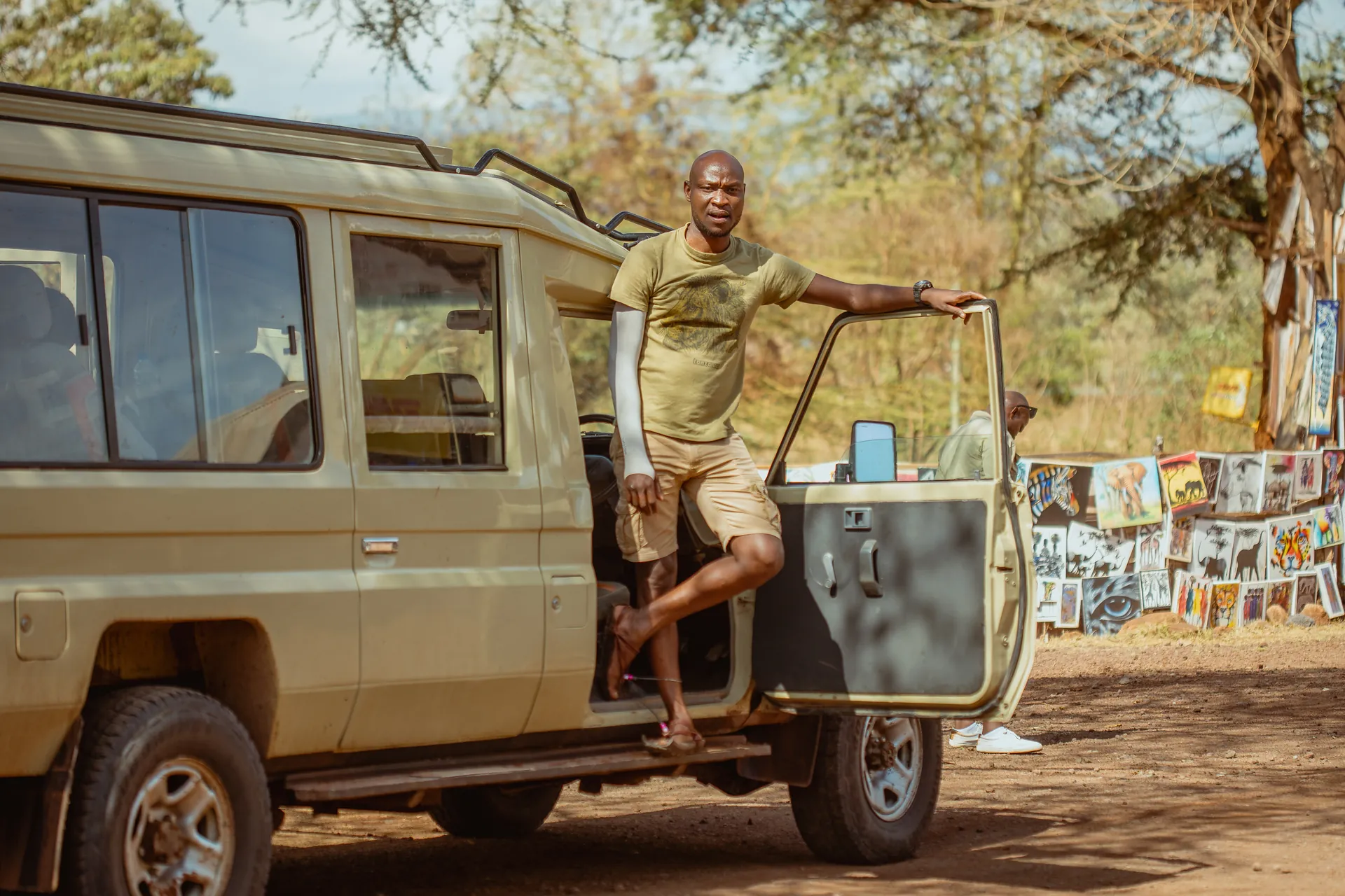 Safari vehicle travelling through a Tanzania wildlife area